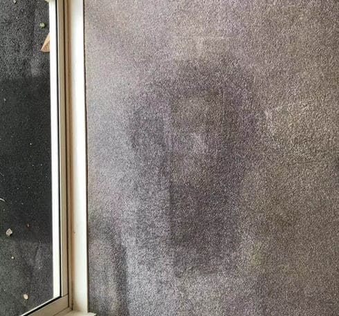 Stubborn carpet stain near a window before professional cleaning by Triple Star Commercial Cleaning in Christchurch and Auckland.