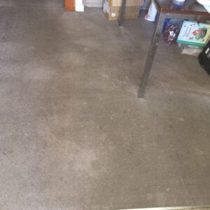 Carpet before heavy-duty cleaning service, showing stains and dirt buildup.