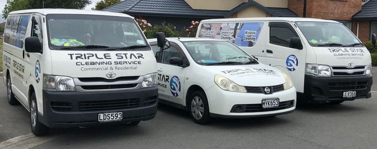 The fleet of Triple Star Commercial Cleaning vehicles parked and ready for service.