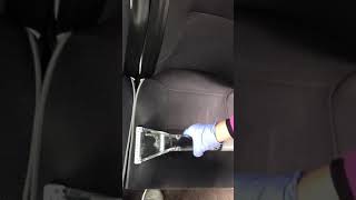 Car seat cleaning using specialized upholstery cleaning equipment.