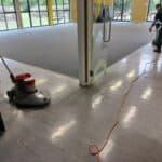 Triple Star Commercial Cleaning staff performing end-of-lease commercial floor cleaning in a large venue in Auckland and Christchurch