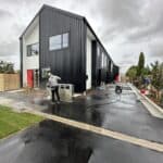 Post-construction cleaning of a driveway and exterior of a townhouse in Christchurch and Auckland.