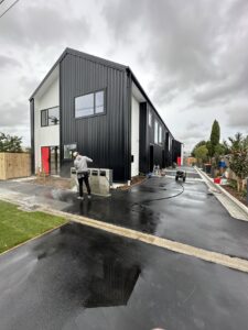 Post-construction cleaning of a driveway and exterior of a townhouse in Christchurch and Auckland.