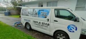 Side view of Triple Star cleaning van parked at client property