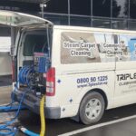 Triple Star carpet cleaning van parked outside a commercial office building