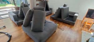 Soft playroom couches at a preschool set up for cleaning and drying