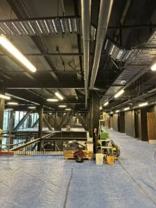 Professional builders cleaning at a commercial construction site in Christchurch by Triple Star Commercial Cleaning