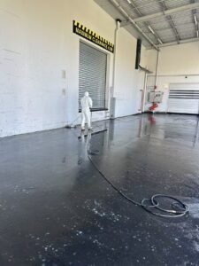 Commercial loading dock pressure washing and concrete cleaning in Christchurch by Triple Star Commercial Cleaning.