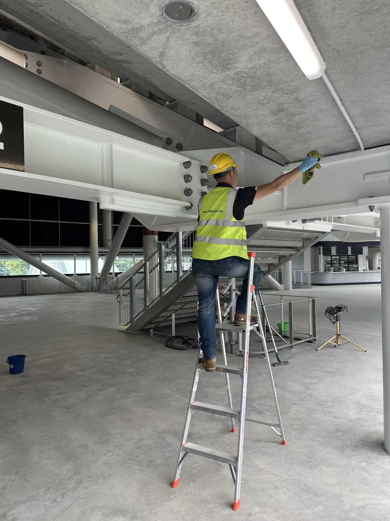 Detailed structural beam and high-level surface cleaning at One New Zealand Stadium, Christchurch, during the builders cleaning process.